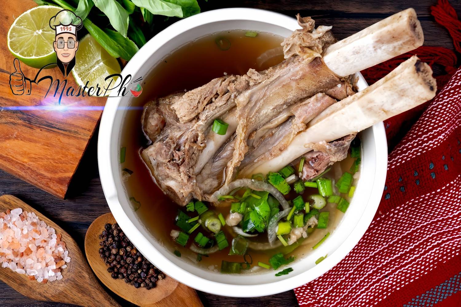 A clear aromatic bowl of beef pho with rice noodles at Master Pho in Doraville