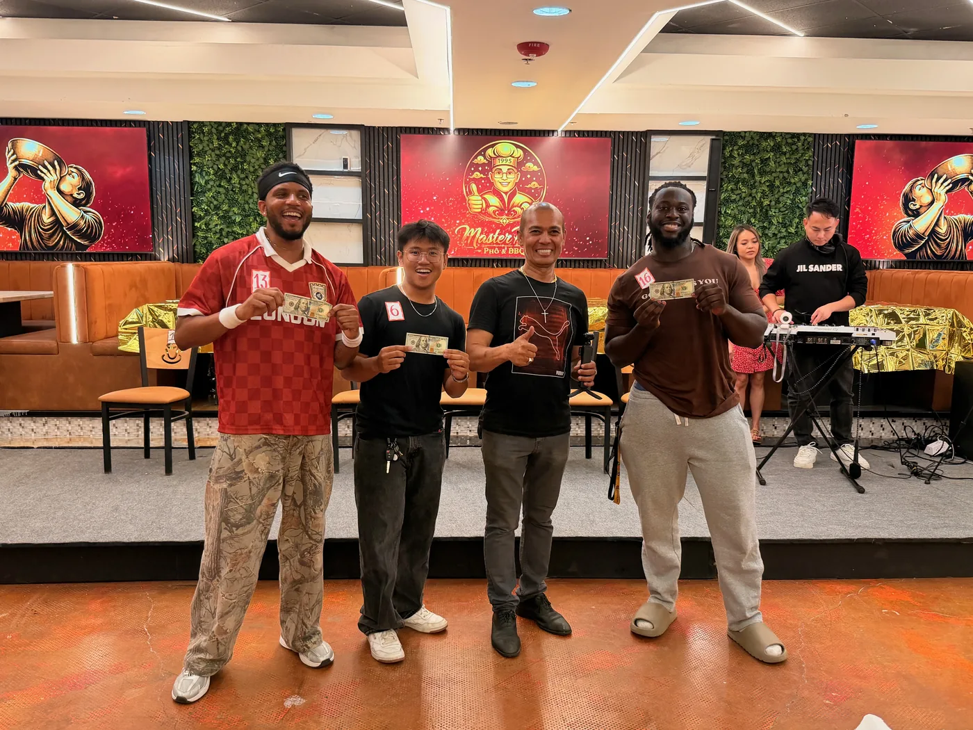 Master Pho Challenge winners holding their cash prizes